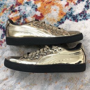 GOLD Pumas with black rubber sole. Women’s Size 7